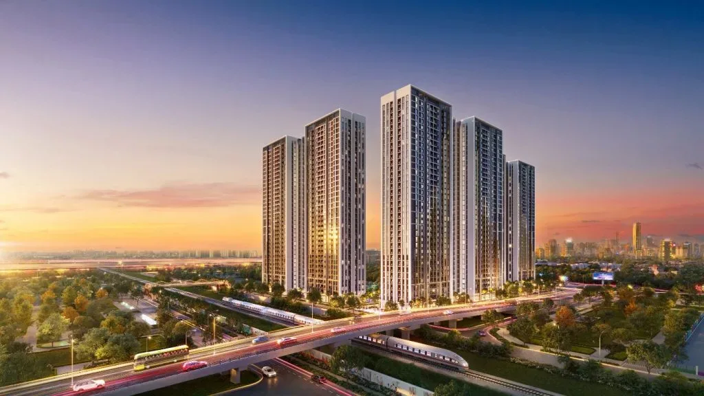 Phối cảnh cụm tháp căn hộ cao tầng bên tuyến đường trên cao lúc hoàng hôn, dự án của MIK Group