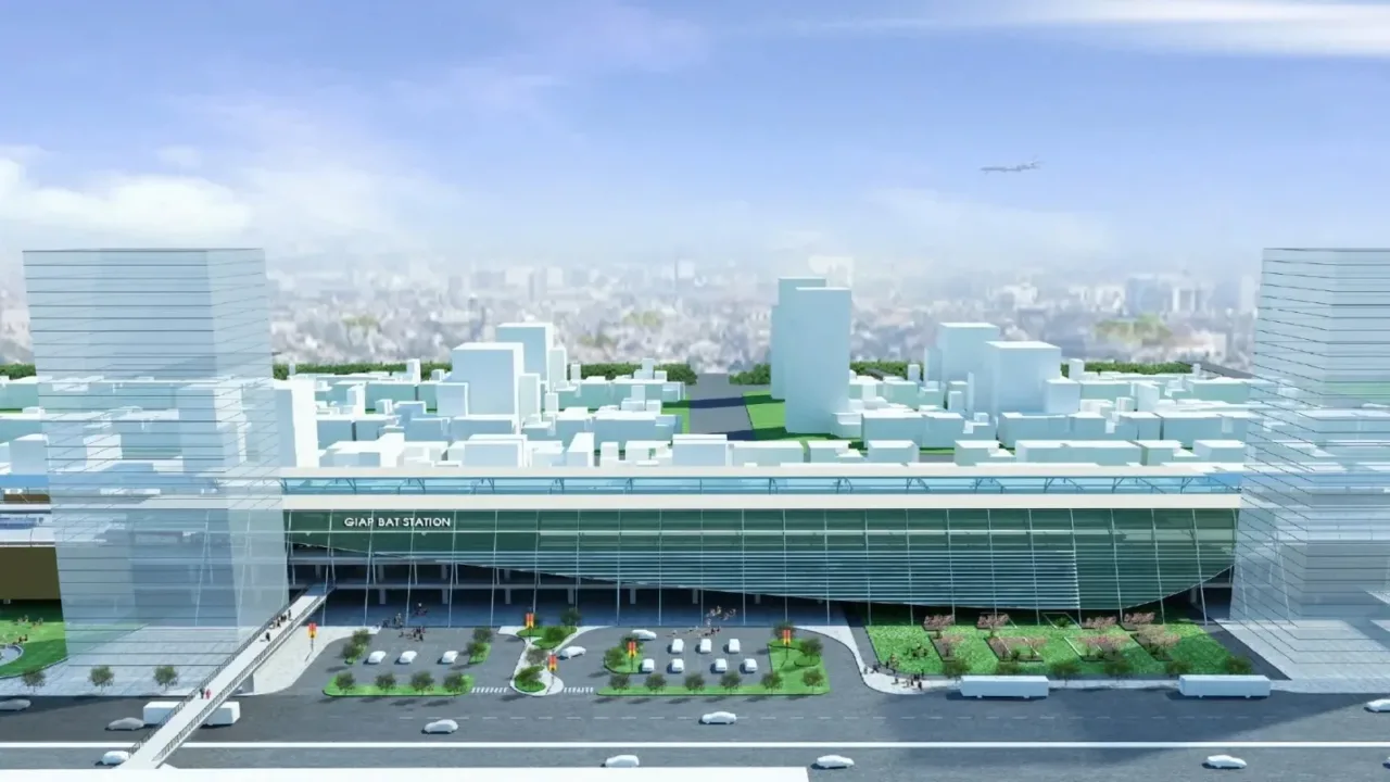 Phối cảnh nhà ga metro Hà Nội với mái kính lớn, quảng trường và bãi đỗ xe phía trước, các tòa nhà cao tầng hai bên