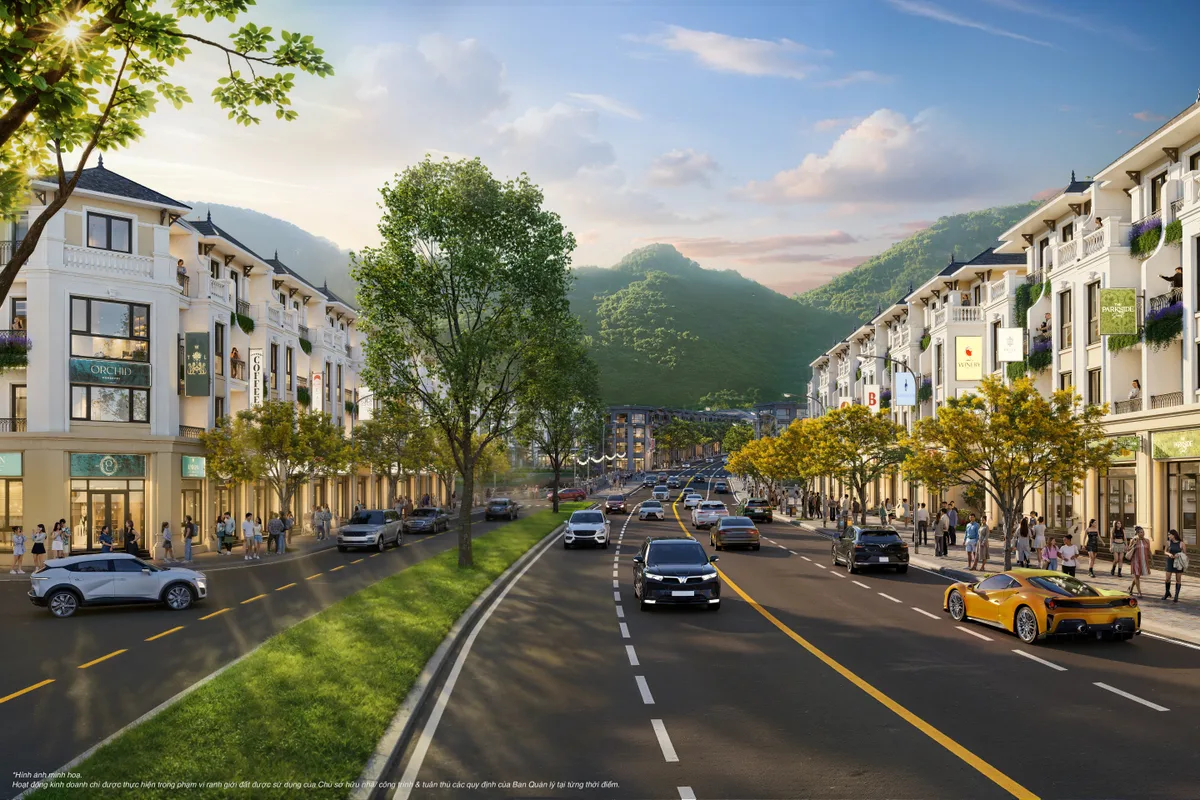 Phối cảnh dãy nhà phố thấp tầng dọc trục đường lớn, núi xanh phía sau tại Vinhomes Hải Vân Bay