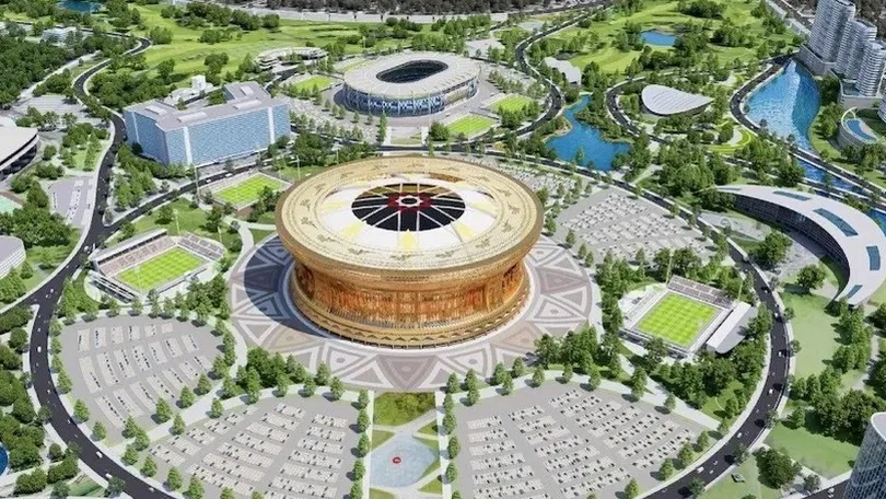 Phối cảnh sân vận động lớn hình tròn giữa khu đô thị có sân cỏ, hồ nước và công viên